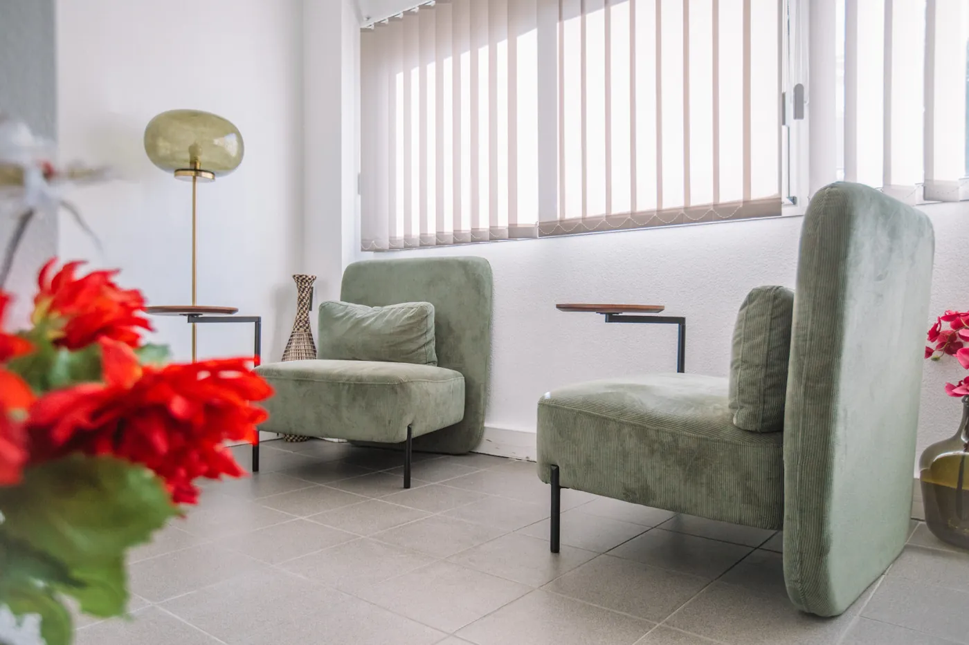 Lounge area with green velvet armchairs at the Millénaire coworking centre